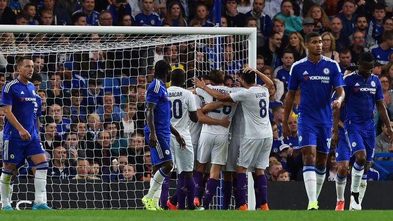 Fiorentina players celebrate Gonzalo Rodriguez's decisive goal at Stamford Bridge