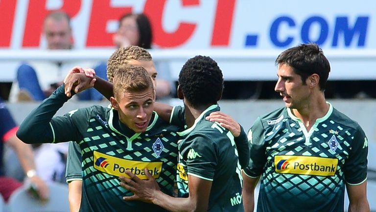 Thorgan Hazard (L), of Borussia Moenchengladbach is congratulated by his team mates after scoring against Newcastle