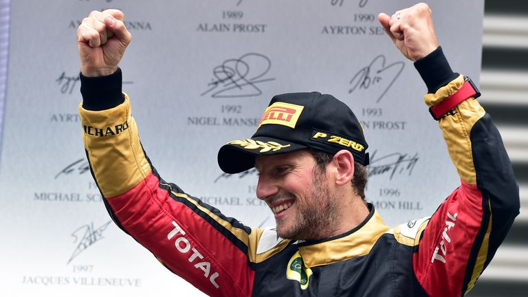 Third-placed  Romain Grosjean  celebrates on the podium 