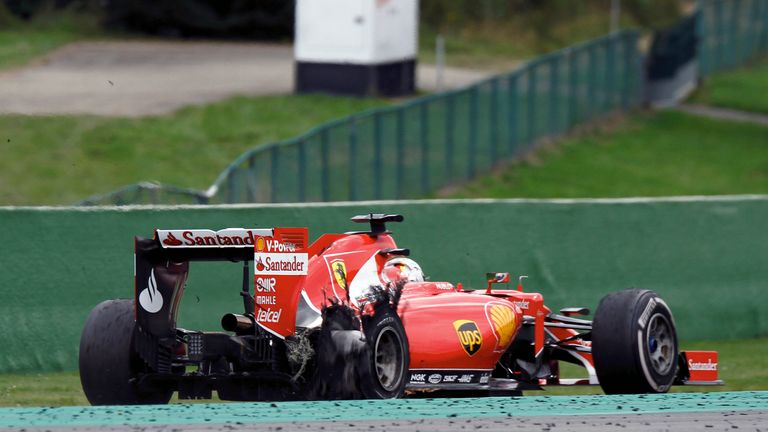 Sebastian Vettel limps back to the pits after his blowout