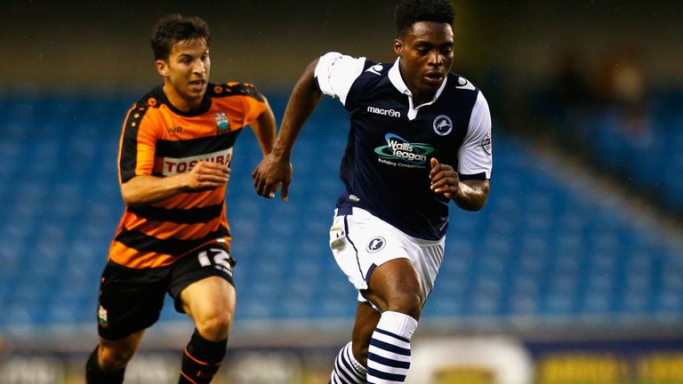 Fred Onyedinma of Millwall moves away from Luke Gambin of Barnet during the Capital One Cup First Round match between Millwal
