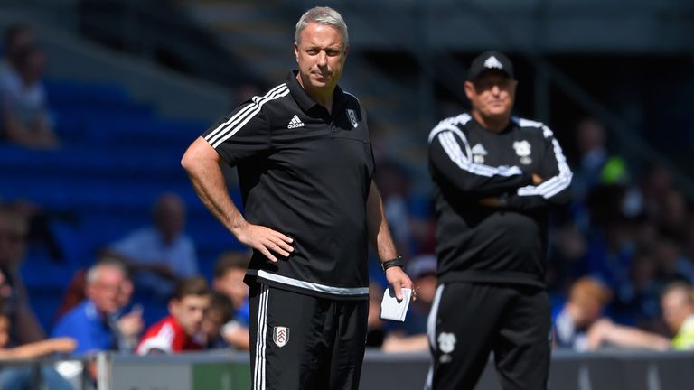 Fulham manager Kit Symons and Russell Slade of Cardiff react on the touchline