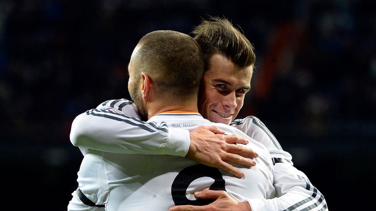 Real Madrid's French forward Karim Benzema (L) is congratulated by Real Madrid's Welsh forward Gareth Bale after scoring a goal during the Spanish league f