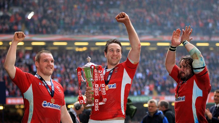 (L-R) Gethin Jenkins, Ryan Jones and Adam Jones celebrate Wales' Grand Slam victory with the Six Nations trophy in 2012