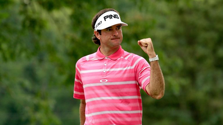 Bubba Watson reacts after a birdie putt during the final round of the World Golf Championships - Bridgestone Invitational
