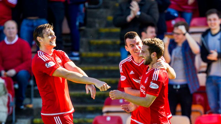 Aberdeen's Graeme Shinnie (right) celebrates his opener with Ash Taylor (left) and Paul Quinn against Kilmarnock. 