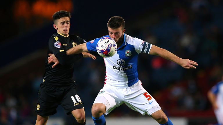 Grant Hanley of Blackburn Rovers holds off a challenge from Zach Clough of Bolton Wanderers during the Sky Bet Championship clash at Ewood Park
