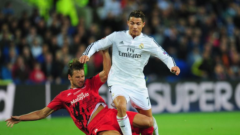 Grzegorz Krychowiak challenges Cristiano Ronaldo