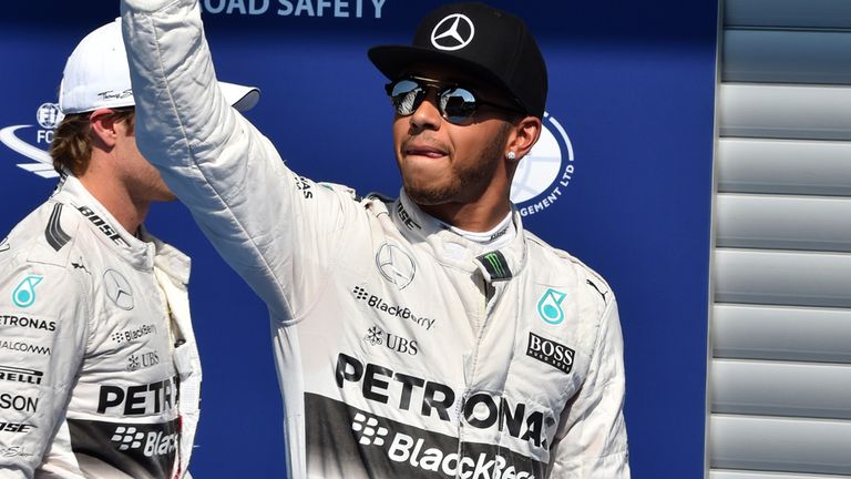 Pole sitter Lewis Hamilton celebrates in parc ferme 