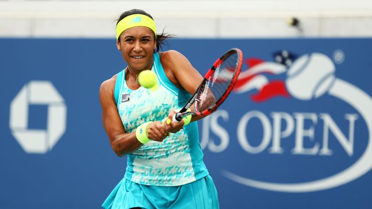 Heather Watson of Great Britain returns a shot