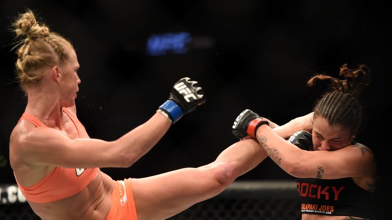 LOS ANGELES, CA - FEBRUARY 28:  (L) Holly Holm kicks Raquel Pennington in their women's bantamweight bout during the UFC 184 event at Staples Center on Feb