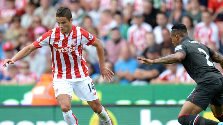 Stoke City's Ibrahim Afellay looks to take on Nathaniel Clyne of Liverpool