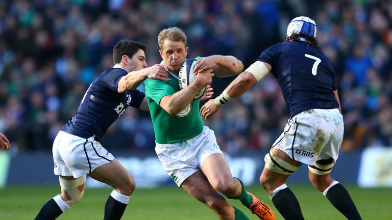 Luke Fitzgerald of Ireland holds off Sam Hidalgo-Clyne and Blair Cowan of Scotland during the RBS Six Nations match