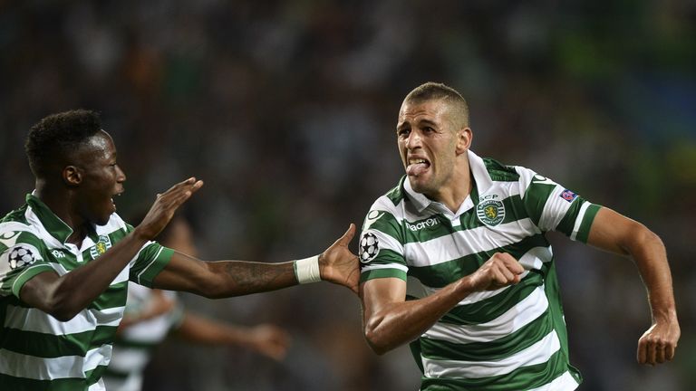 Sporting forward Islam Slimani (R) celebrates a goal with his teammate Sporting's forward Carlos Mane (L)