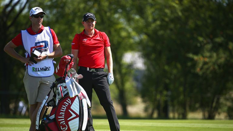 PRAGUE, CZECH REPUBLIC - AUGUST 26:  James Morrison of England looks on with his caddie during a practice round ahead of the D+D Real Czech Masters at Alba