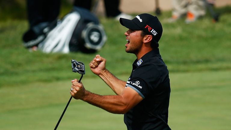 Jason Day celebrates holing a long birdie putt at the seventh