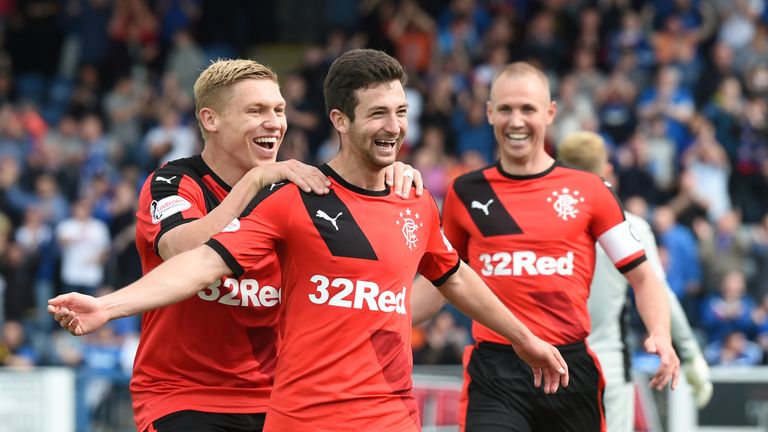 Jason Holt (centre) celebrates after making it 3-0 at Palmerston Park