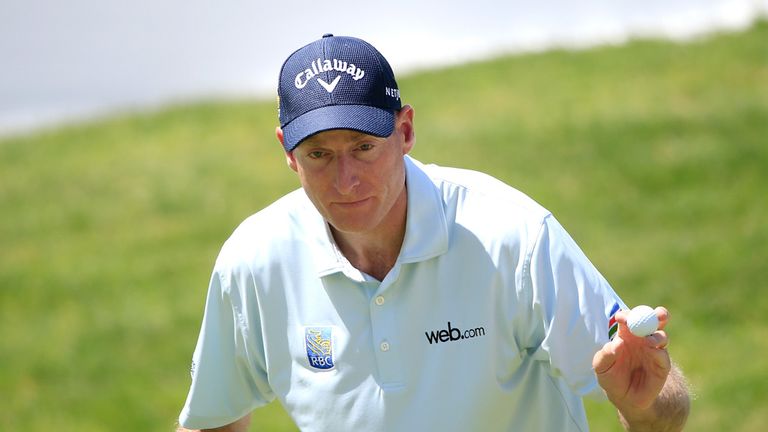 Jim Furyk reacts after a putt on the 18th green during the second round of the World Golf Championships - Bridgestone Invitational at Firestone