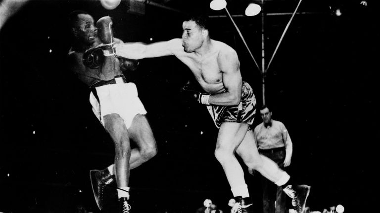 Joe Louis (right) rocks Jersey Joe Walcott withduring their world heavyweight contest at the Yankee Stadium