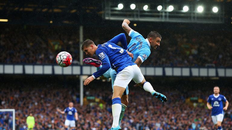 John Stones of Everton challenges for the ball with Aleksandar Kolarov of Manchester City during the Barclays Premier League at Goodison Park