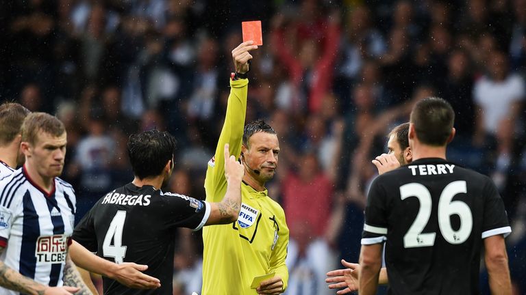 Referee Mark Clattenburg shows the red card to John Terry