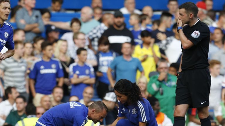 Referee Michael Oliver (right) summoned physio Jon Fearn and club doctor Eva Carneiro on to the pitch to treat Eden Hazard at the player's request
