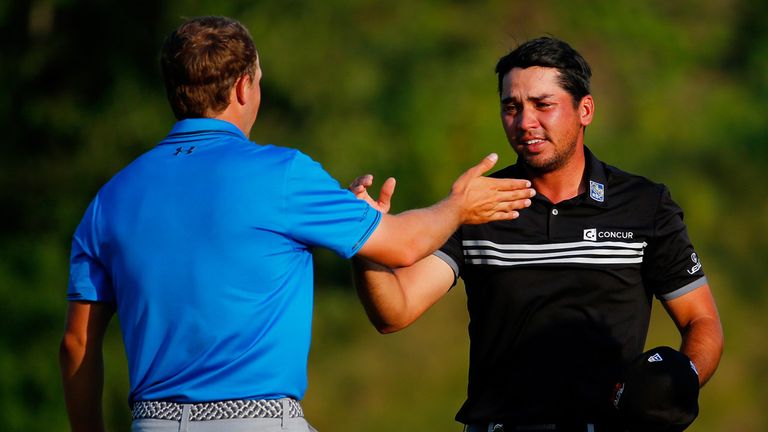 Jordan Spieth of the United States greets Jason Day of Australia after Day's three-stroke victory at the 2015 PGA Championship 