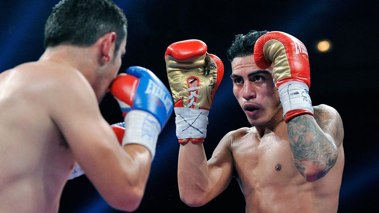 Jose Benavidez Jr. (R) and Mauricio Herrera battle during their WBA interim super lightweight title fightduring their WBA int