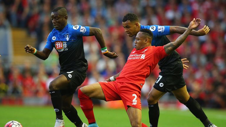 (L-R) Joshua King (R) and Max Gradel of Bournemouth (L) battle with Nathaniel Clyne of Liverpool (C)