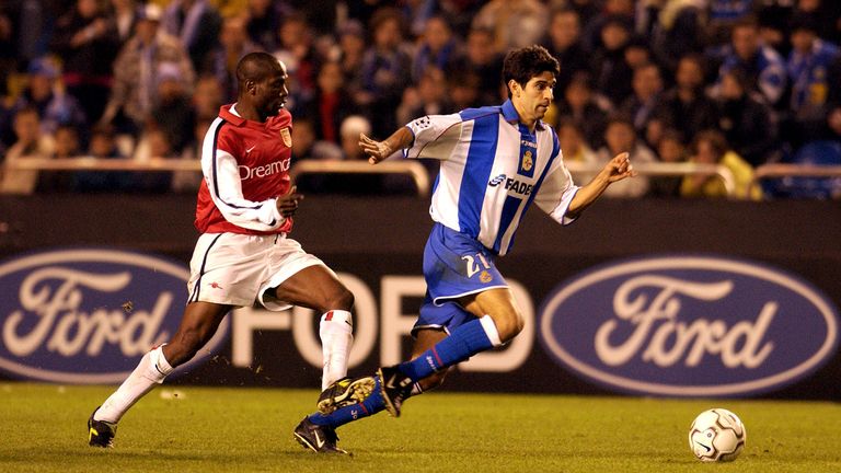 Juan Carlos Valeron of Deportivo breaks away from Lauren of Arsenal during the UEFA Champions League Group D Stage Two match in November 2001