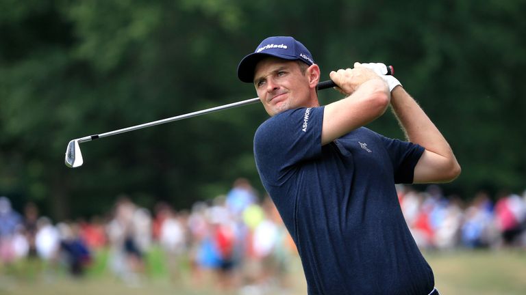 Justin Rose of England plays a shot on the second hole during the final round of the World Golf Championships - Bridgestone Invitati