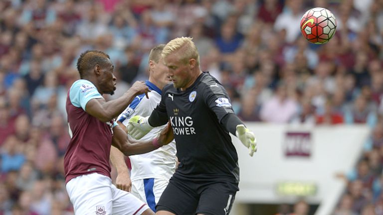 Diafra Sakho of West Ham United is stopped in his tracks by the arm of Leicester's Kasper Schmeichel.