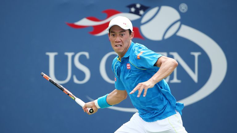 Kei Nishikori returns a shot against Benoit Paire at the US Open 