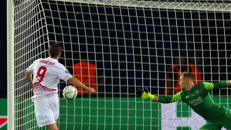 Kevin Gameiro of Sevilla scores their third goal from the penalty spot