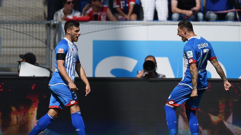 SINSHEIM, GERMANY - AUGUST 22: Kevin Volland of Hoffenheim celebrates with his team-mates after scoring his team's first goal during the Bundesliga