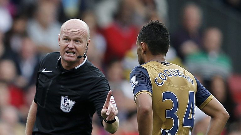 Referee Lee Mason speaks to Arsenal midfielder Francis Coquelin during the Premier League match between Crystal Palace and Arsenal at Selhurst Park