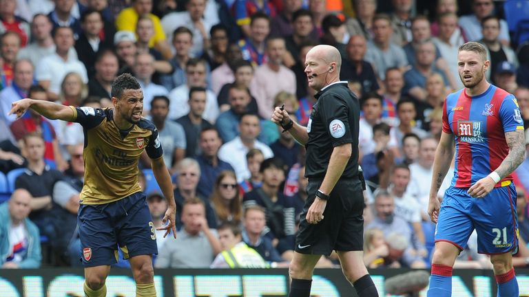 Francis Coquelin of Arsenal complains to the referee Lee Mason during the Barclays Premier League match between Crystal Palace and Arsenal