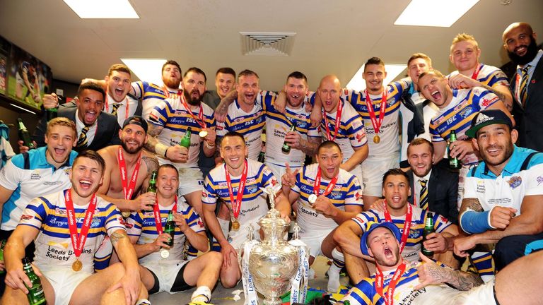 Leeds celebrate with the Challenge Cup trophy.