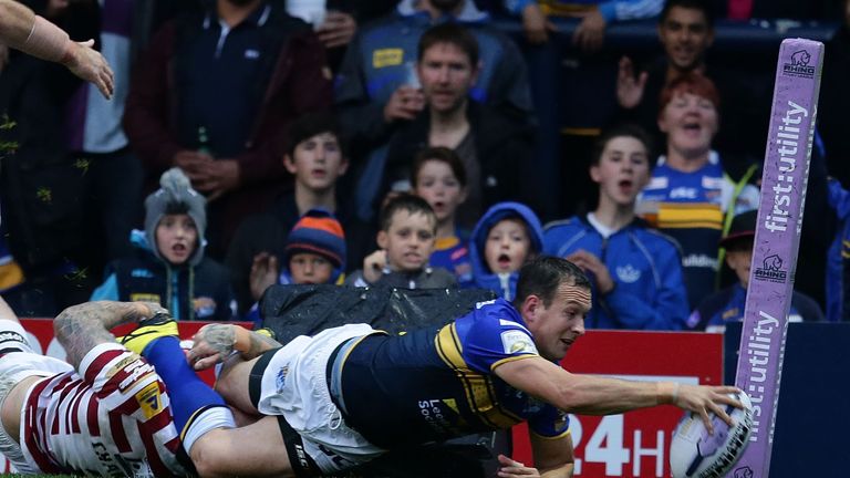 Danny McGuire crosses for Leeds Rhinos in their Super 8s clash against Wigan Warriors