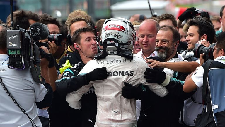 Lewis Hamilton celebrates with his Mercedes crew