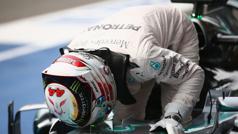 Lewis Hamilton kisses his car 