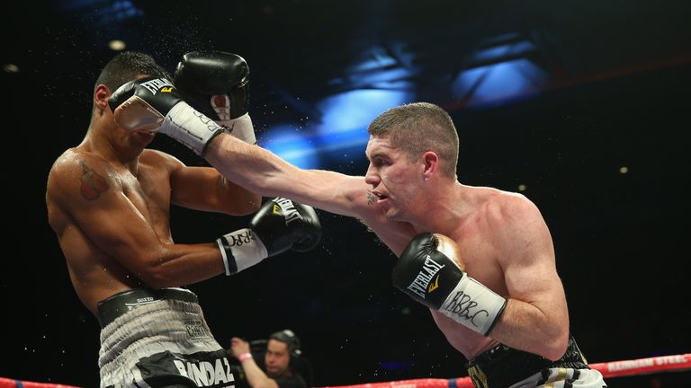 LIVERPOOL, ENGLAND - APRIL 18:  Liam Smith lands a right punch on David Ezequiel Romero during the Vacant WBO Intercontinental Light-Middleweight Champions