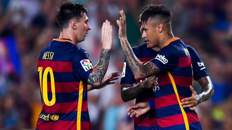 Neymar (R) of  Barcelona celebrates with his teammate Lionel Mess after scoring the opening goal