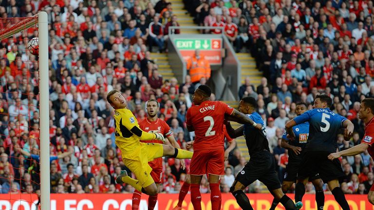 Liverpool's goalkeeper Simon Mignolet (L) watches against Bournemouth