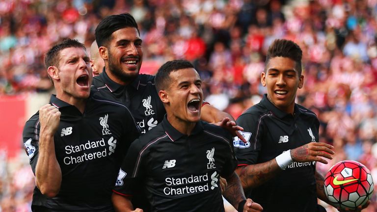Philippe Coutinho with team-mates James Milner, Emre Can and Roberto Firmino of Liverpool