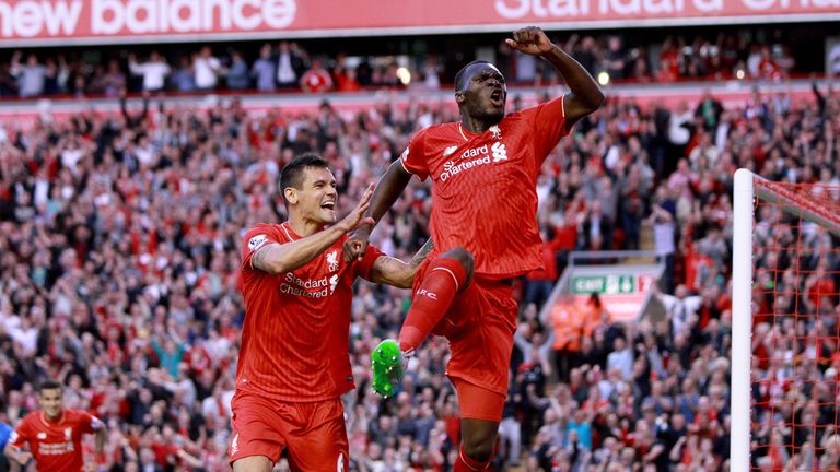 Liverpool's Christian Benteke (right) celebrates scoring his side's first goal of the game during the Barclays Premier League match at Anfield, Liverpool. 