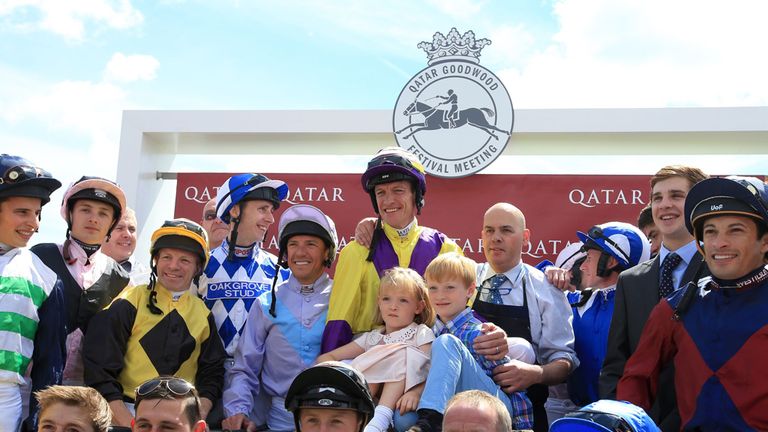 Richard Hughes is joined by fellow jockeys and family