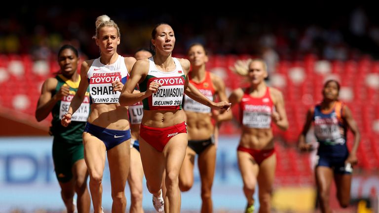 BEIJING, CHINA - AUGUST 26:  Lynsey Sharp of Great Britain (C-L) and Marina Arzamasova of Belarus (C-R) compete in the Women's 800 metres heats 