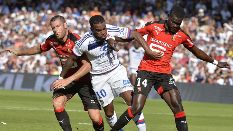 Lyon's French forward Alexandre Lacazette (C) vies with Rennes' French defender Sylvain Armand (L) and Rennes' French-Senegalese defender Fallou Diagne.