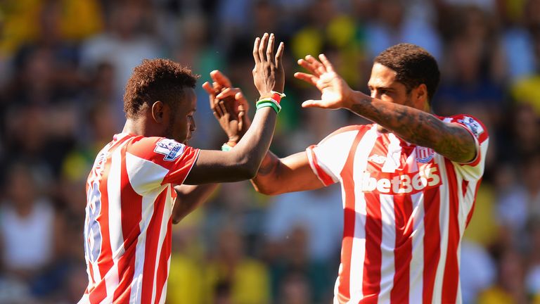 Mame Biram Diouf celebrates alongside Glen Johnson after opening the scoring against Norwich